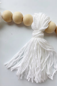 mode, wood beaded garland w yarn tassels
