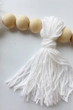 mode, wood beaded garland w yarn tassels
