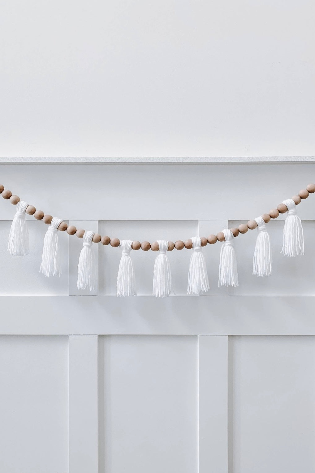mode, wood beaded garland w yarn tassels
