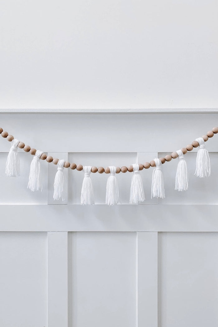 mode, wood beaded garland w yarn tassels