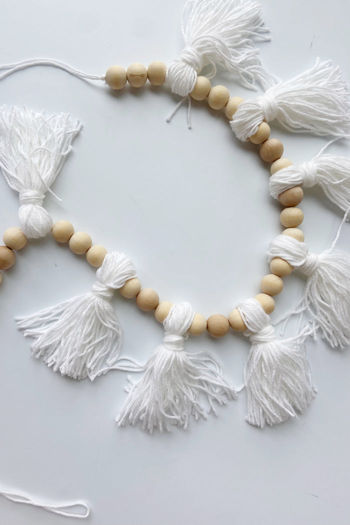 mode, wood beaded garland w yarn tassels