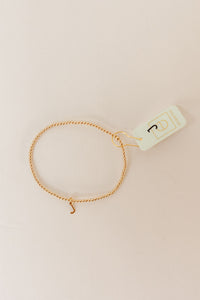 classic gold 2mm bead bracelet - respect gold charm