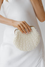 she's a pearl clutch