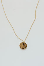 mode, palm coin necklace