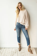 mode, with open arms sweater