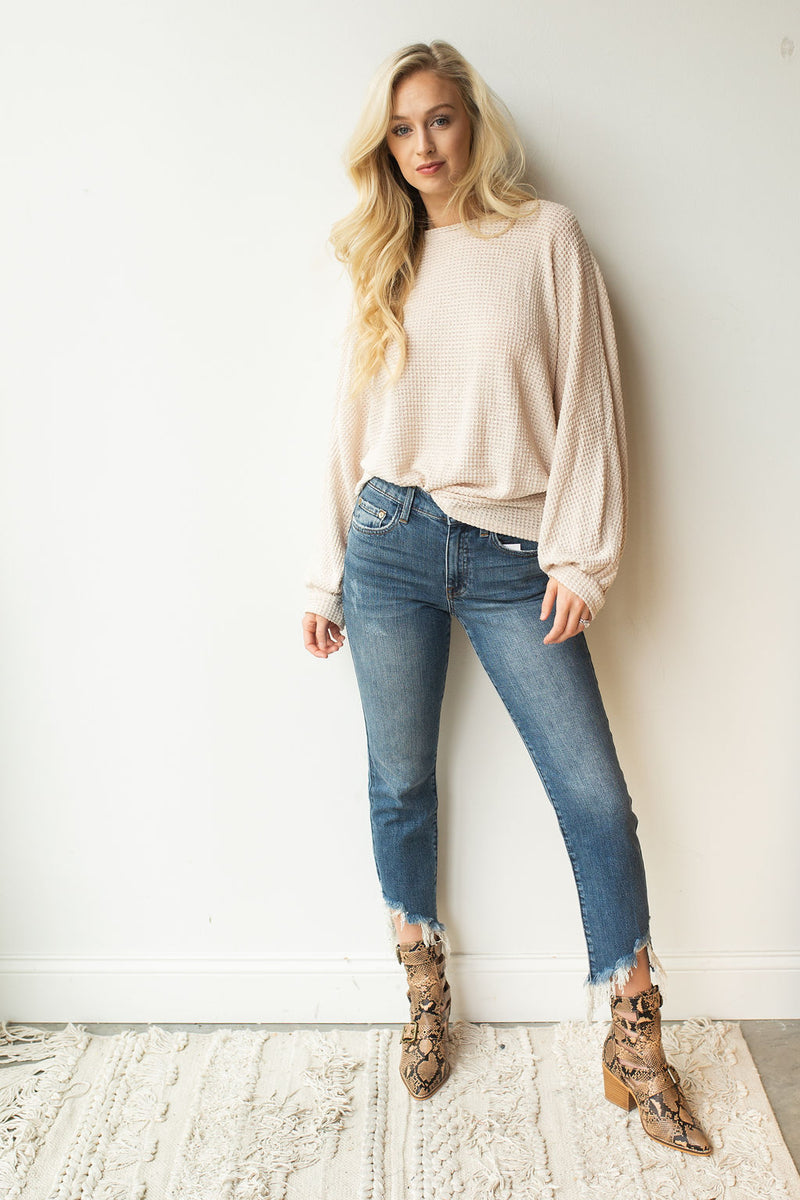 mode, with open arms sweater