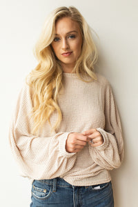 mode, with open arms sweater
