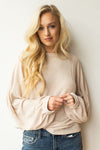 mode, with open arms sweater