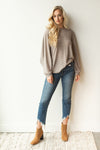 mode, with open arms sweater