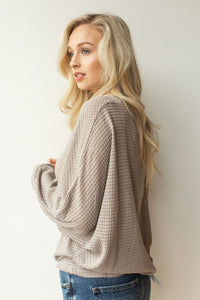 mode, with open arms sweater