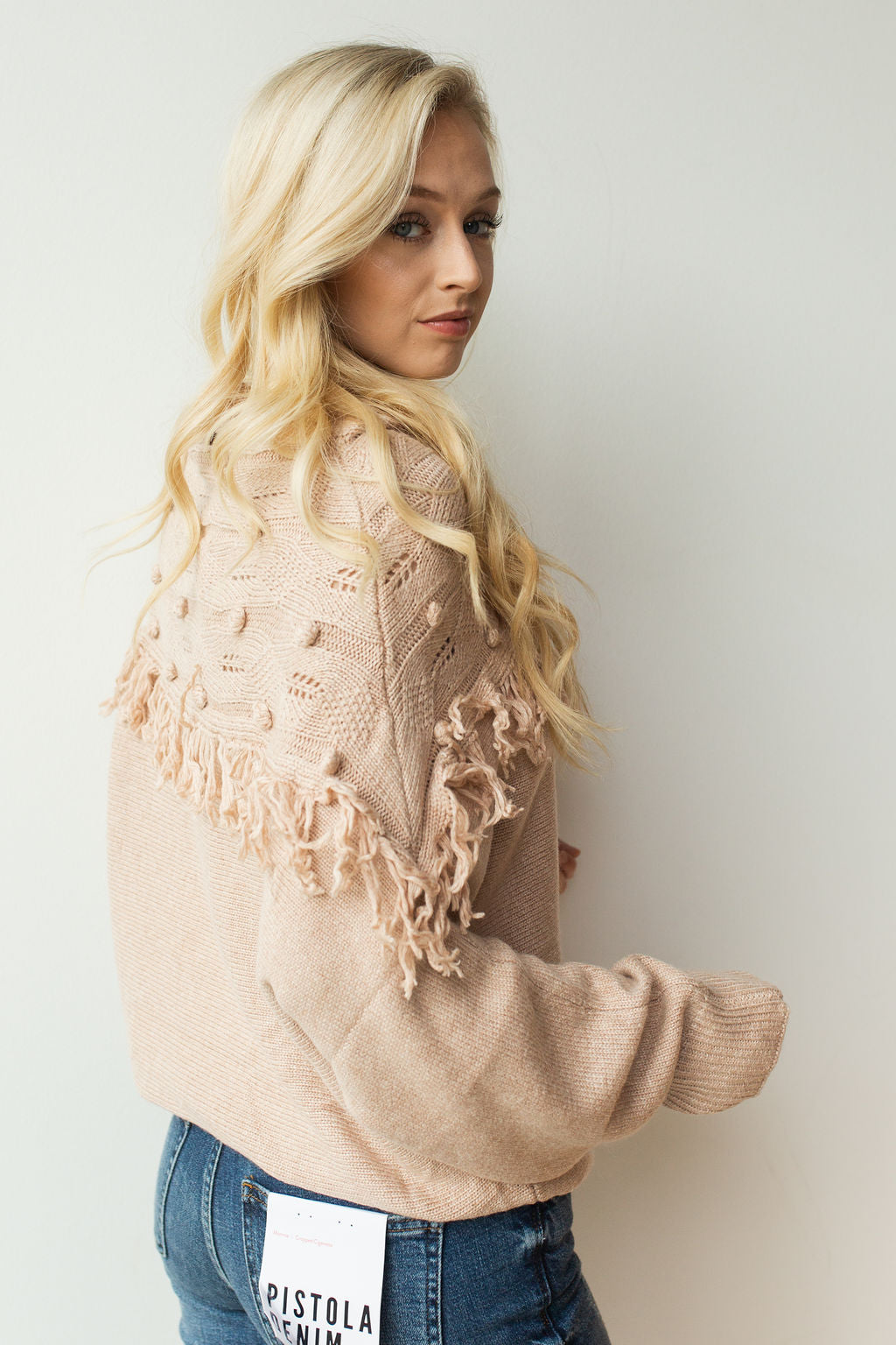 mode, pom pom + fringe combo sweater
