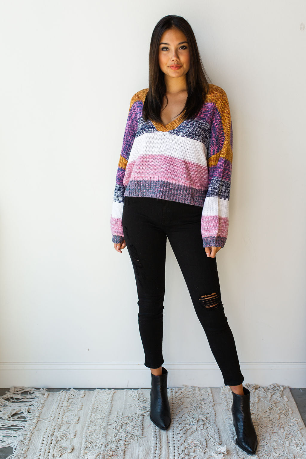 mode, line of color v neck sweater