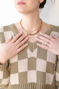 mode, cross baguette ring