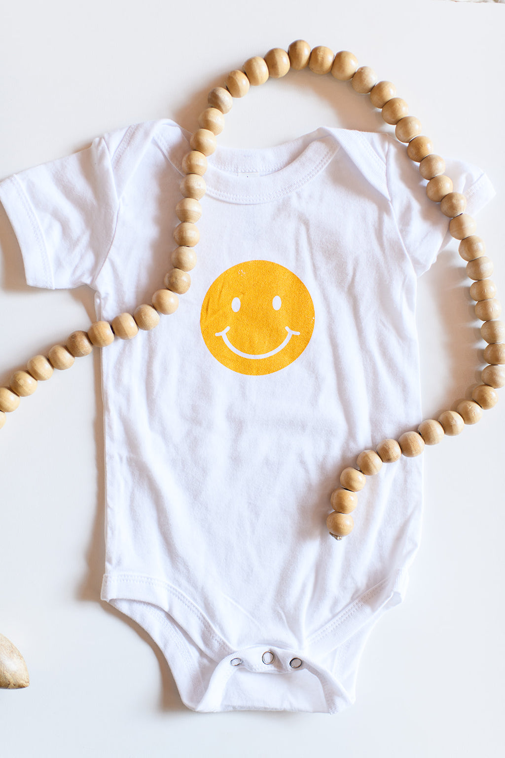 mode, smiles are contagious onesie