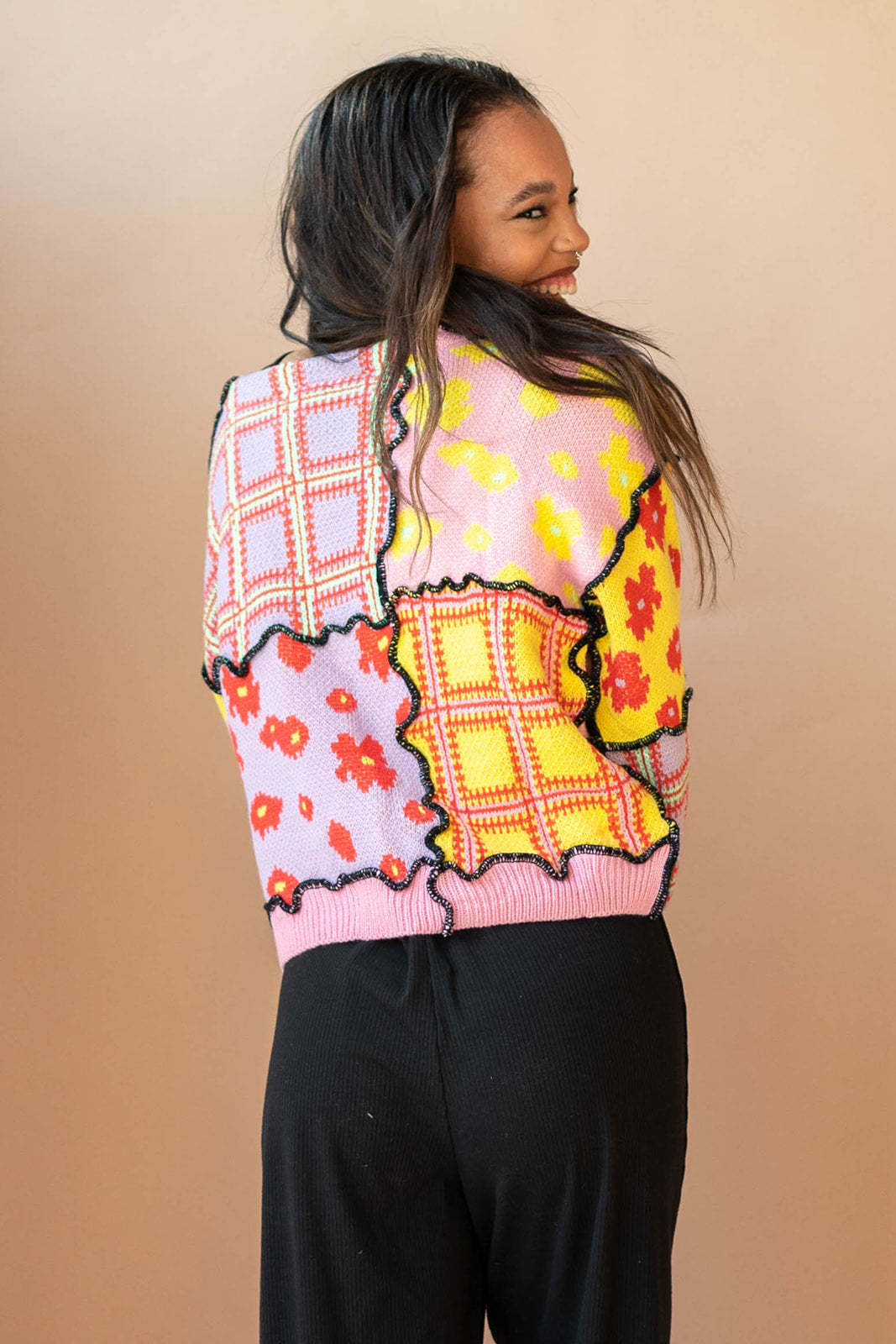 mode, we got a letter knit top