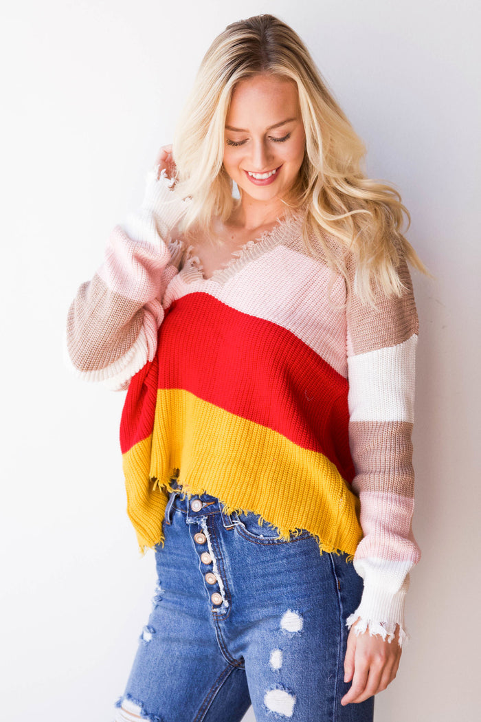 mode, things are lookin' up distressed sweater