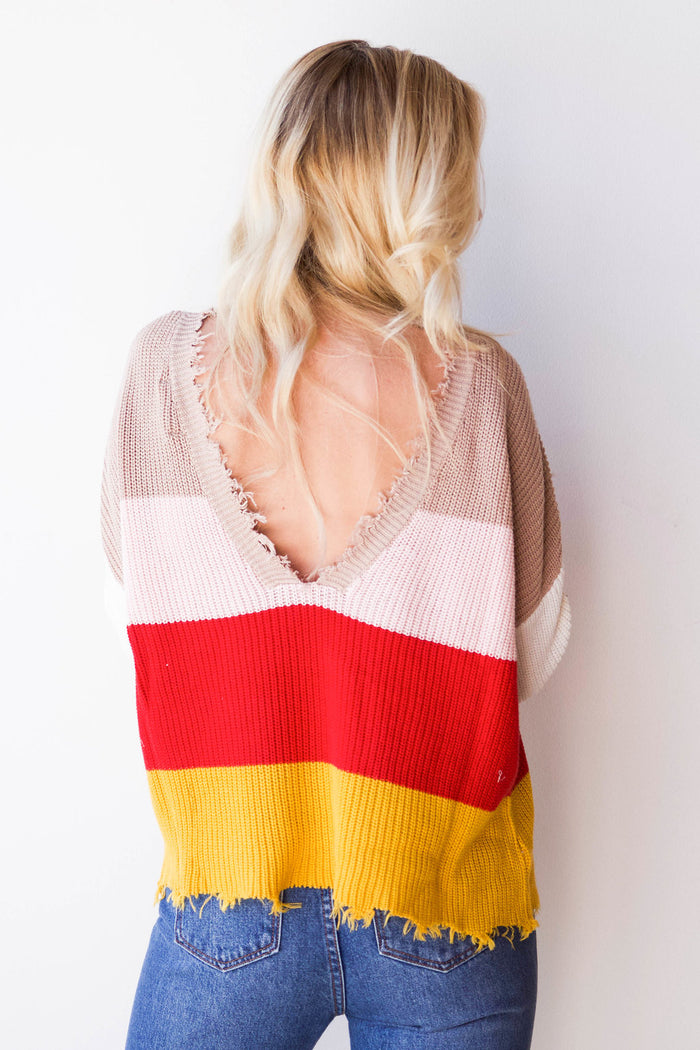 mode, things are lookin' up distressed sweater