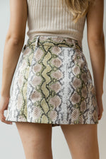 mode, snakeskin buckle front skirt