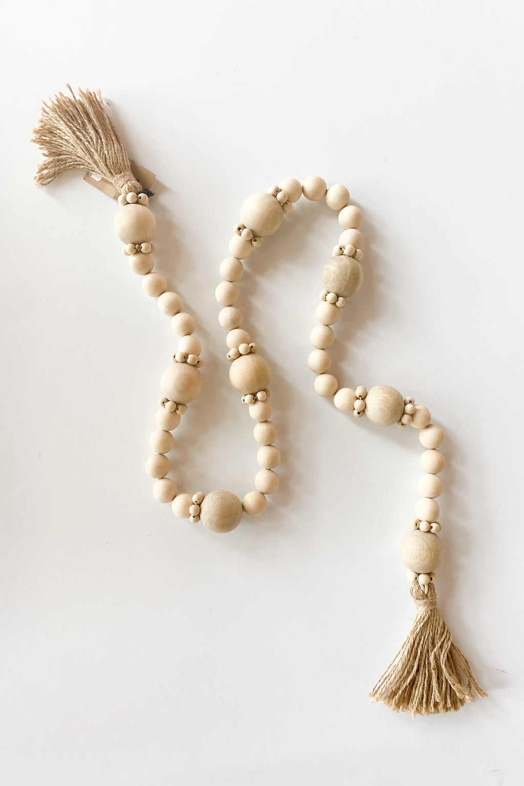mode, wood bead garland + jute tassels