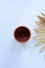 mode, orange stoneware planter