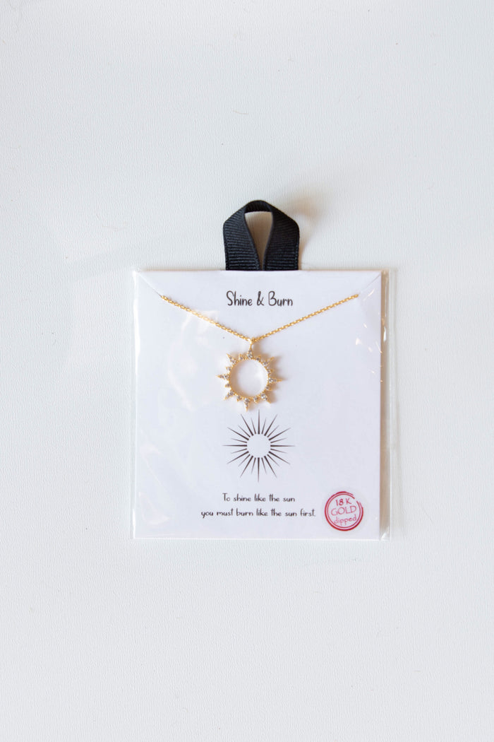 mode, shine & burn sunburst necklace