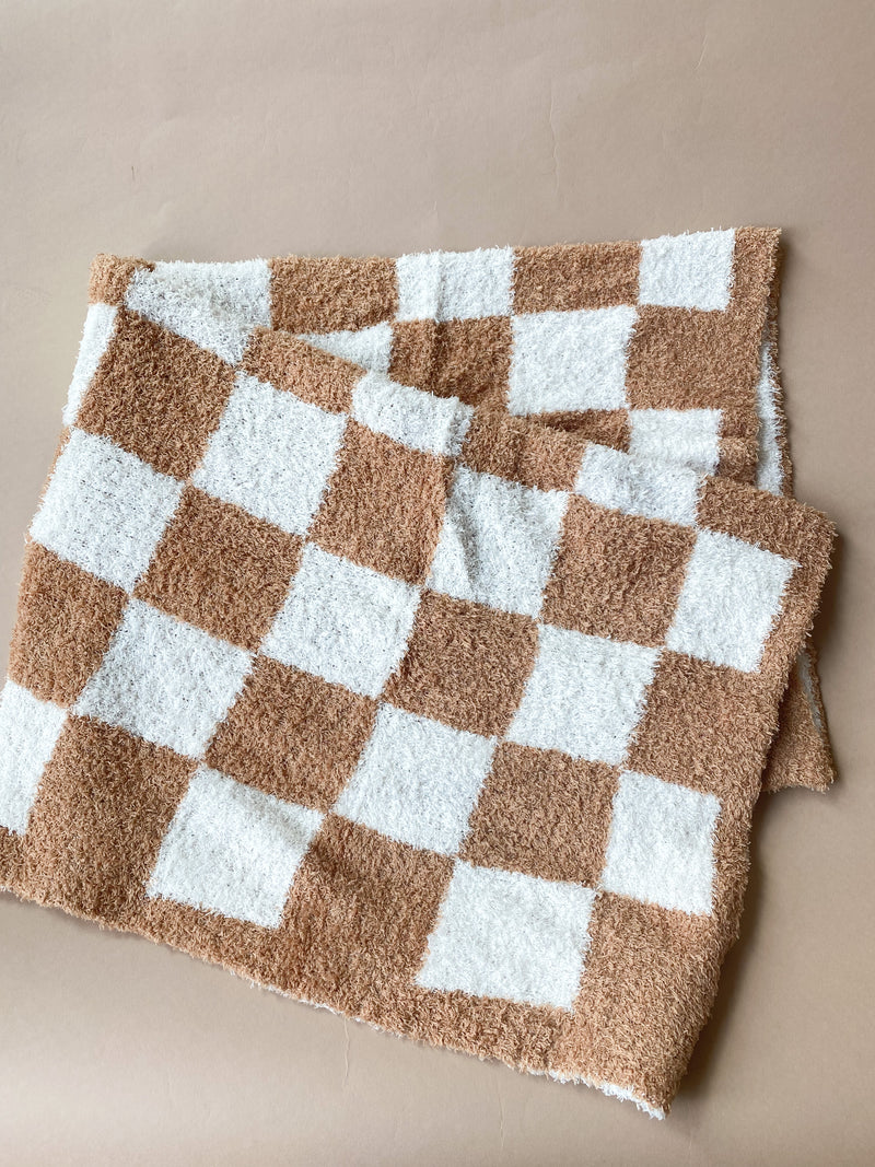 mode, tan checkered blanket