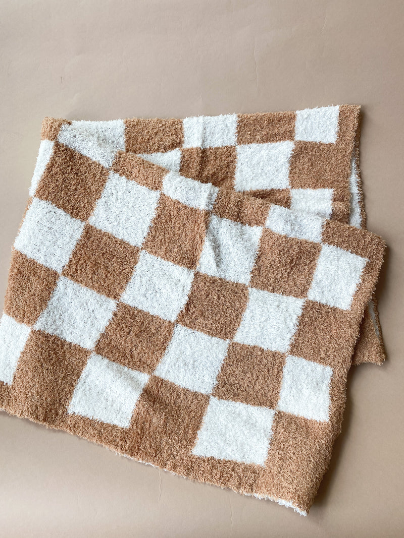 tan checkered blanket