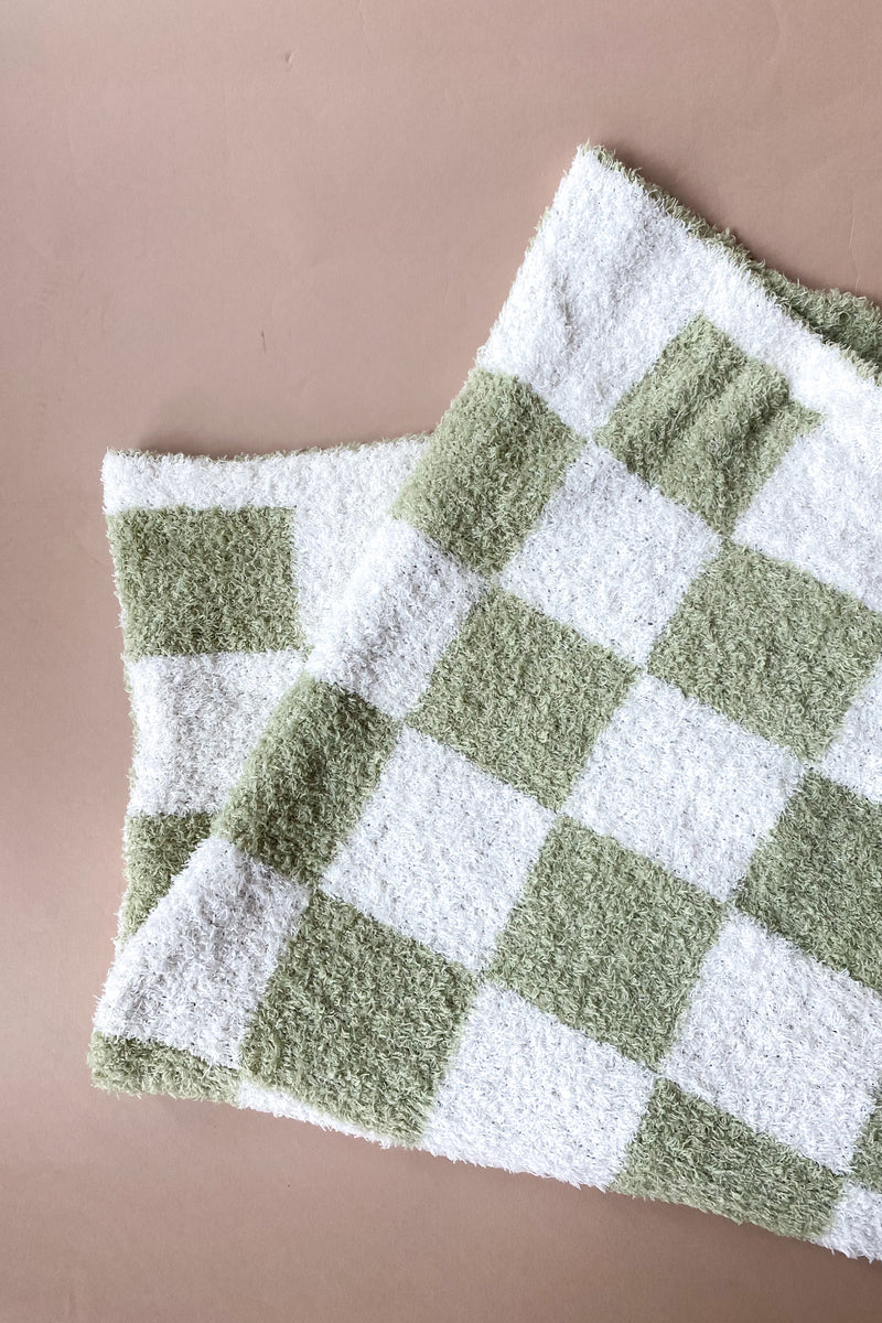 mode, green checkered blanket